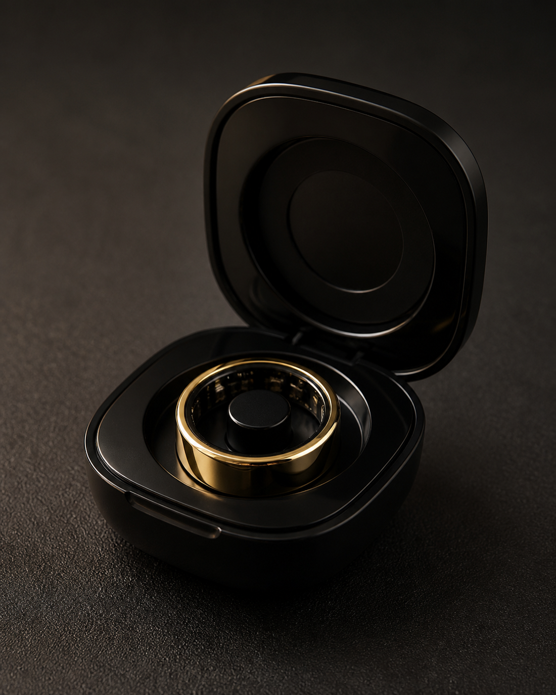 LazyGdgets R09 gold ring seated in its open black charging case